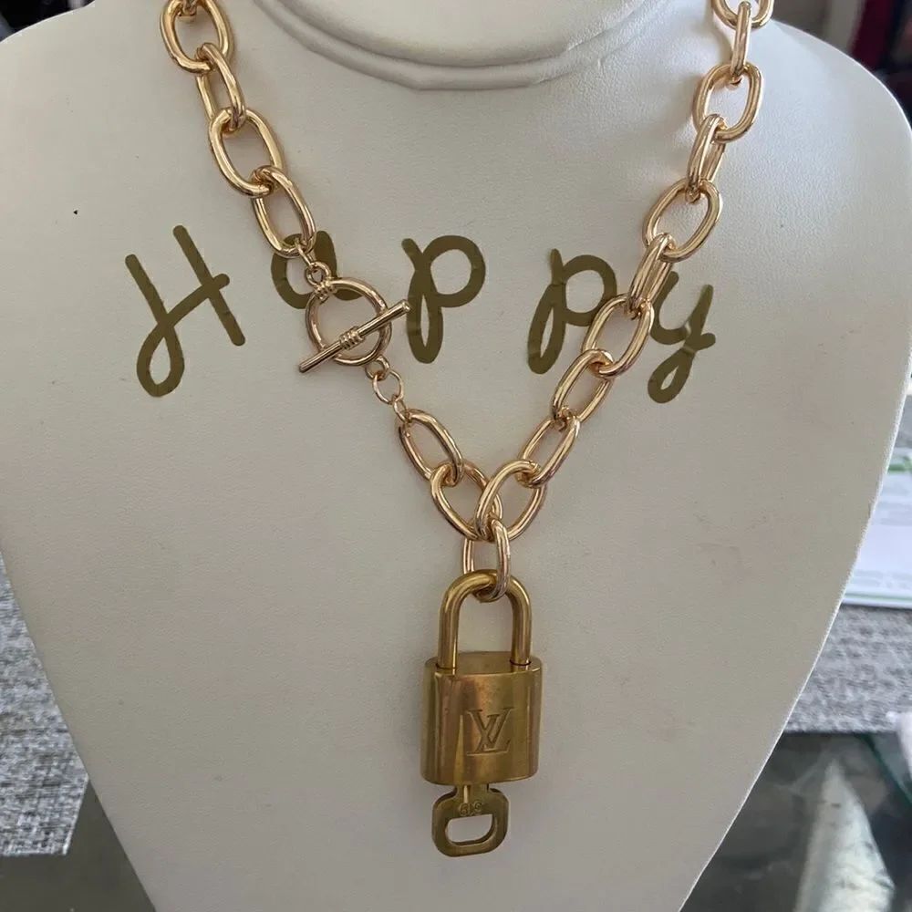 LV key lock with key 100% authentic with NWT necklace